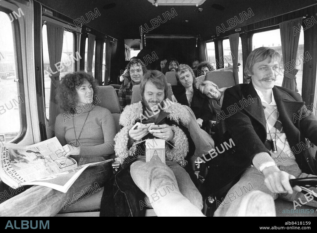 ABBA in their tour bus somewhere in Sweden, November 19, 1974. Anni-Frid Lyngstad, Benny Andersson and bus driver Hansi Schwarz. In the back seat Bjorn Ulvaeus and Agnetha Faltskog.. Photo: Olle Karud / Expressen / TT / code 30.