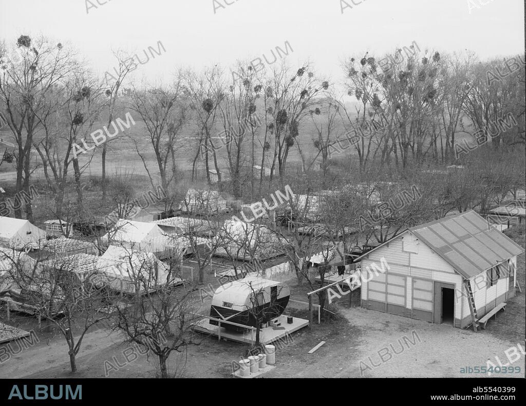 DOROTHEA LANGE. Farm Security Administration (FSA) temporary camp for migrants. Gridley, California. Peak of the season is August.