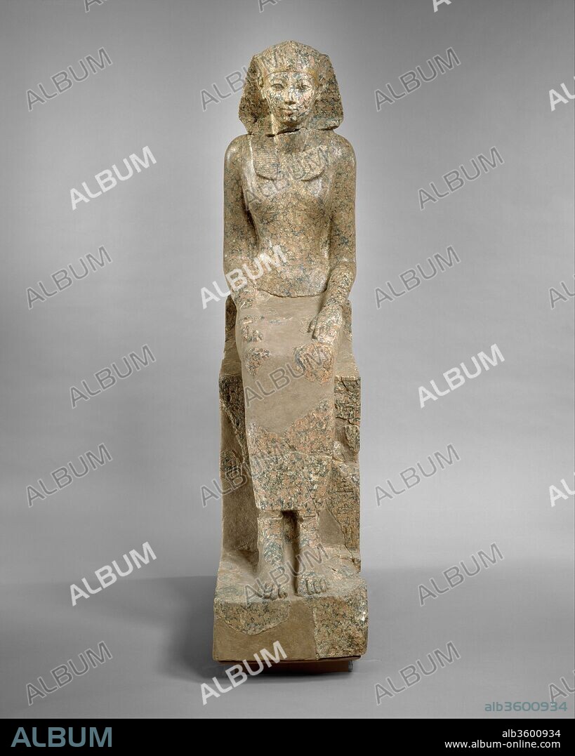 The Female Pharaoh Hatshepsut. Dimensions: H. 170 × W. 41 × D. 90 cm, 620.5 kg (66 15/16 × 16 1/8 × 35 7/16 in., 1368 lb.) (as reassembled). Dynasty: Dynasty 18. Reign: Joint reign of Hatshepsut and Thutmose III. Date: ca. 1479-1458 B.C..
This graceful, life-size statue depicts Hatshepsut in female attire, but she wears the nemes headcloth, a royal attribute usually reserved for the reigning king. In the columns of text inscribed beside her legs on the front of the throne, she has already adopted the throne name Maatkare, but her titles and epithets are still feminine. Thus, she is "Lady of the Two Lands" and "Bodily Daughter of Re." On the back of the throne, part of an enigmatic scene is preserved which probably consisted of two back-to-back goddesses. The goddess has the body of a pregnant hippopotamus with feline legs and a crocodile tail appears behind her legs. Although this resembles Taweret, the goddess who protects women and children, it is probably Ipi, a royal protector who appears in the same position on a statue of the Seventeenth Dynasty king Sebekemsaf I (ca. 1575 B.C.) in the British Museum.
In the early 1920s the Museum's Egyptian Expedition excavated numerous fragments of the statue near Hatshepsut's temple at Deir el-Bahri in western Thebes. The torso, however, had been found in 1869 and was in the Rijksmuseum van Oudheden in Leiden. In 1998, the Leiden torso and the Met's portions of the statue were reunited for the first time since the original was destroyed in about 1460 B.C.  The statue now travels between the two Museums and is currently on view in Leiden until 2016.