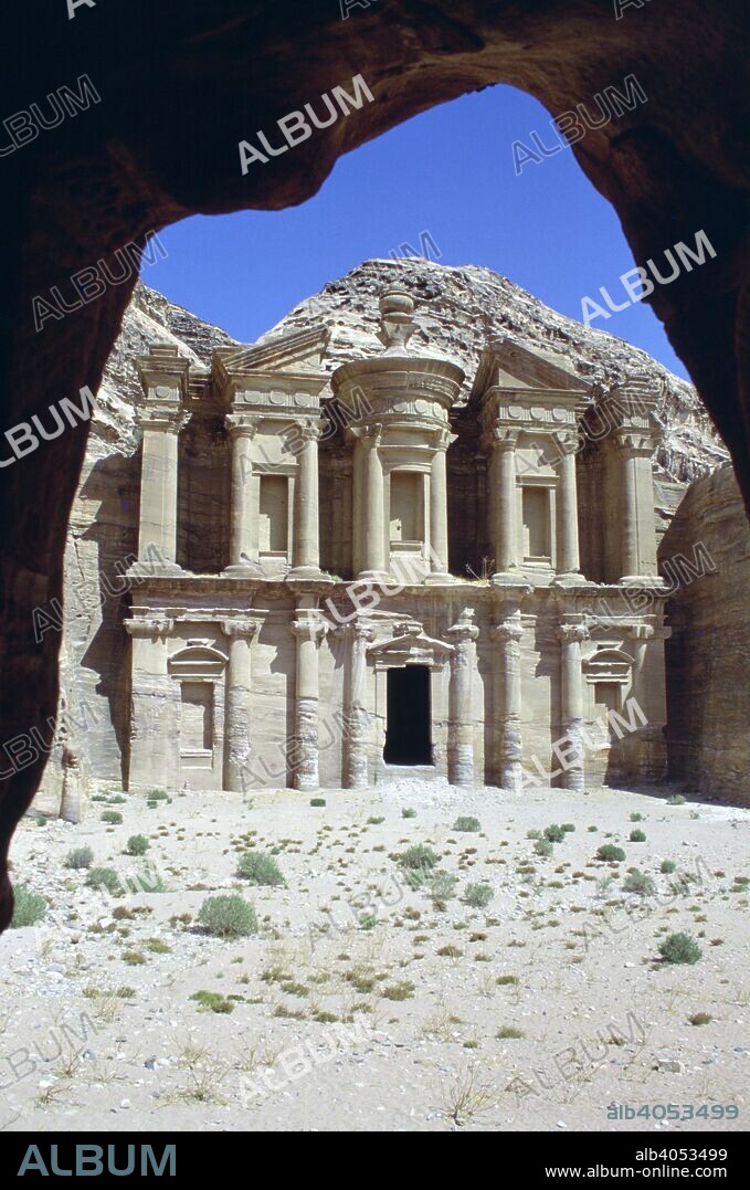 El Deir (the Monastery), Petra, Jordan. Petra was the capital of the Nabataean kingdom from 312 BC until it was absorbed into the Roman Empire in 106 AD. The city is best known for its buildings with elaborate facades cut out of the sandstone rock. Despite its name the Monastery was in fact a tomb.