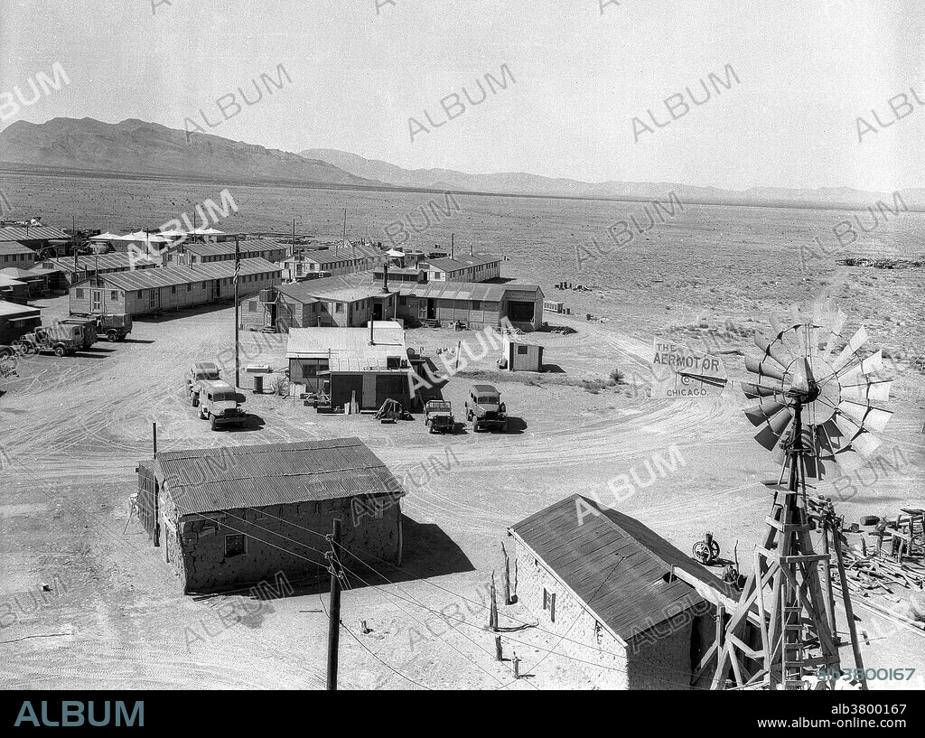 The Manhattan Project was a research and development program by the United States with the United Kingdom and Canada that produced the first atomic bomb during World War II. From 1942 to 1946, the project was under the direction of Major General Leslie Groves of the US Army Corps of Engineers. In March 1944, planning for the test was assigned to Kenneth Bainbridge, a professor of physics at Harvard, working under Kistiakowsky. Because of the complexity of an implosion-style weapon, it was decided that, despite the waste of fissile material, an initial test would be required. Groves approved the test, subject to the active material being recovered. Consideration was therefore given to a controlled fizzle, but Oppenheimer opted instead for a full-scale nuclear test, codenamed Trinity. Bainbridge selected the bombing range near Alamogordo Army Airfield as the site for the test. Bainbridge worked with Captain Samuel P. Davalos on the construction of the Trinity Base Camp and its facilities, which included barracks, warehouses, workshops, an explosive magazine and a commissary. Security was very strict. Personnel were required to remain in the camp at all times unless working.