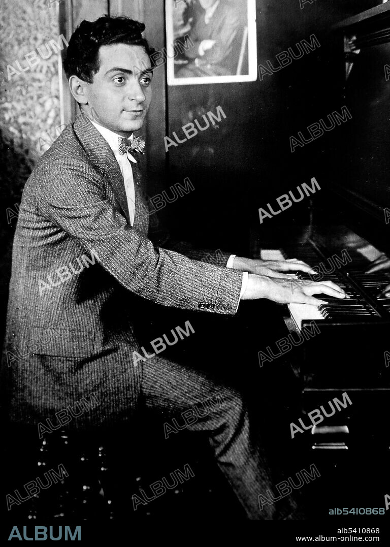 Publicity photo of Berlin at his first job with a music publisher, aged 18. Irving Berlin (May 11, 1888 - September 22, 1989) was an American composer and lyricist, widely considered one of the greatest songwriters in American history. During his 60-year career he wrote an estimated 1,500 songs, including the scores for 20 original Broadway shows and 15 original Hollywood films, with his songs nominated eight times for Academy Awards. No photographer credited, 1906 (cropped and cleaned).
