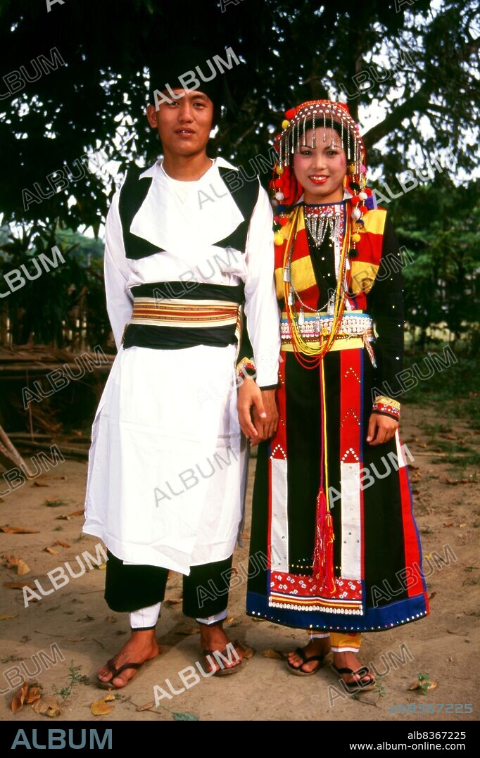 Burma / Myanmar: Lisu couple in traditional costume, Manhkring, Myitkyina, Kachin State.<br/><br/>. The Lisu people (Lìsù zú) are a Tibeto-Burman ethnic group who inhabit the mountainous regions of Burma (Myanmar), Southwest China, Thailand, and the Indian state of Arunachal Pradesh.<br/><br/>. About 730,000 live in Lijiang, Baoshan, Nujiang, Diqing and Dehong prefectures in Yunnan Province, China. The Lisu form one of the 56 ethnic groups officially recognized by the People's Republic of China. In Burma, the Lisu are known as one of the seven Kachin minority groups and an estimated population of 350,000 Lisu live in Kachin and Shan State in Burma. Approximately 55,000 live in Thailand, where they are one of the six main hill tribes. They mainly inhabit the remote country areas. Their culture has traits shared with the Ayi culture.