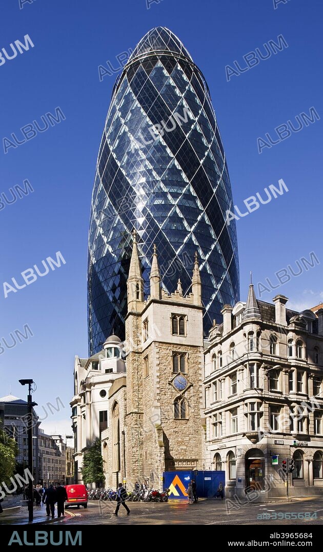 Church of St Andrew Undershaft and the Gherkin, City of London, 2012. The 1894 London Building Act restricted the height of buildings until these regulations were relaxed in the 1950s and the boom in tall buildings began. The tower of the church of St Andrew Undershaft dates from the 15th century, and for centuries it dominated buildings in Leadenhall Street, particularly after the addition of corner pinnacles and a turret in 1883. Many buildings beyond the church were destroyed by fire in 1893, and replaced by the Baltic Mercantile & Shipping Exchange and other commercial buildings. The Baltic Exchange was badly damaged by an IRA bomb in 1992, and made way for 30 St Mary Axe, popularly known as the Gherkin, which was designed by Foster and Partners and completed in 2004.