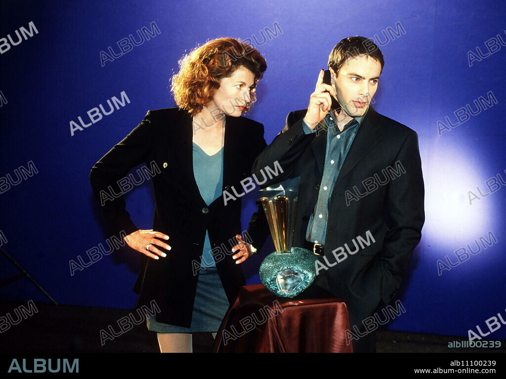 The uncompromising advertising artist Leon accidentally comes across evidence of a murder case. Instead of going to the police, he investigates on his own and falls under the spell of the mysterious, erotic Miriam, who seems to be using him as a puppet in a deadly game... Image: DENISE VIRIEUX (Miriam), GEDEON BURKHARD (Leon) Director: Bodo Fürneisen / Title: DANGEROUS LUST - A MAN IN TEMPTATION / Germany 1998.