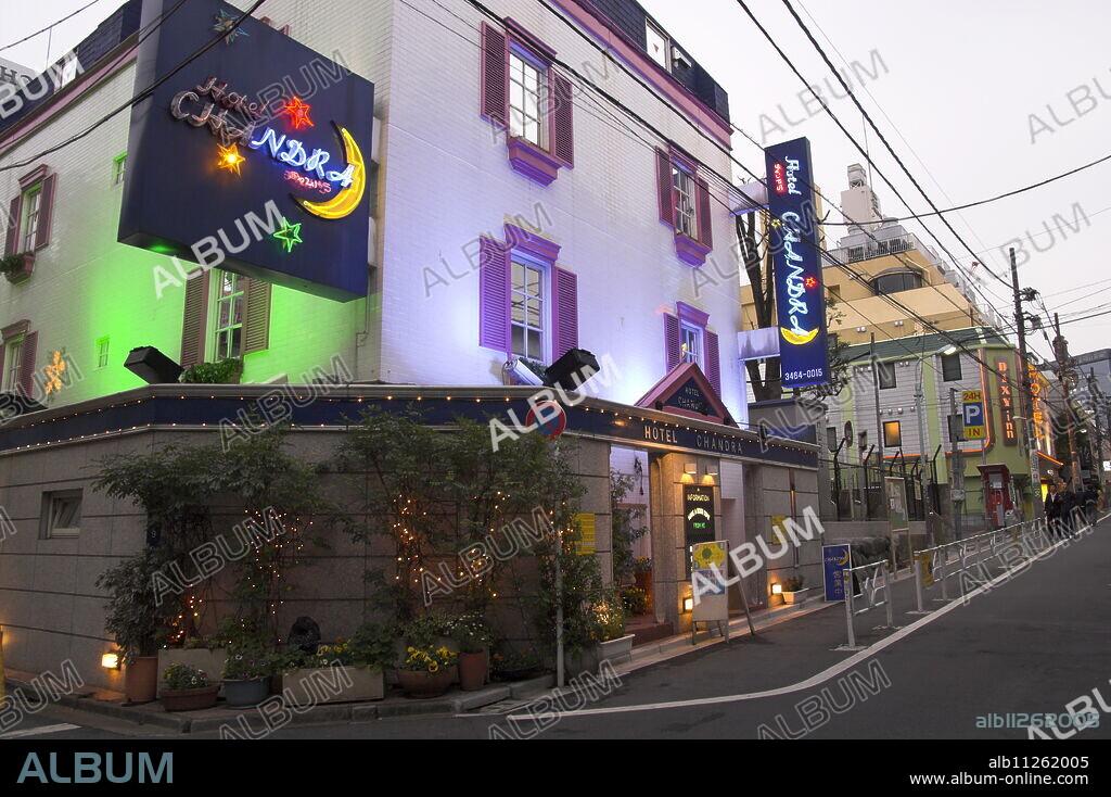 View at dusk of a street with row of love hotels, Dogenzaka, Shibuya, Tokyo, Honshu, Japan, Asia.