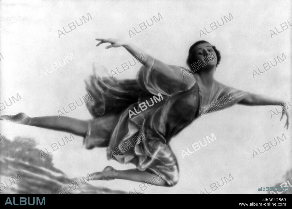 Anna Pavlovna (Matveyevna) Pavlova (February 12, 1881 - January 23, 1931) was a Russian prima ballerina of the late 19th and the early 20th centuries. She was a principal artist of the Imperial Russian Ballet and the Ballets Russes of Sergei Diaghilev. Pavlova is most recognized for the creation of the role The Dying Swan and, with her own company, became the first ballerina to tour ballet around the world. The the public was taken aback by Pavlova's style, a combination of a gift that paid little heed to academic rules: she frequently performed with bent knees, bad turnout, misplaced port de bras and incorrectly placed tours. Such a style in many ways harked back to the time of the romantic ballet and the great ballerinas of old. Her feet were extremely rigid, so she strengthened her pointe shoe by adding a piece of hard wood on the soles for support and curving the box of the shoe. Her solution became, over time, the precursor of the modern pointe shoe, as pointe work became less painful and easier for curved feet. In 1931, while touring in The Hague, Pavlova was told that she had pneumonia and required an operation. She was told that she would never be able to dance again if she went ahead with it. She refused to have the surgery, saying "If I can't dance then I'd rather be dead." She died of pleurisy three weeks short of her 50th birthday. No photographer credited, dated November 2, 1916.