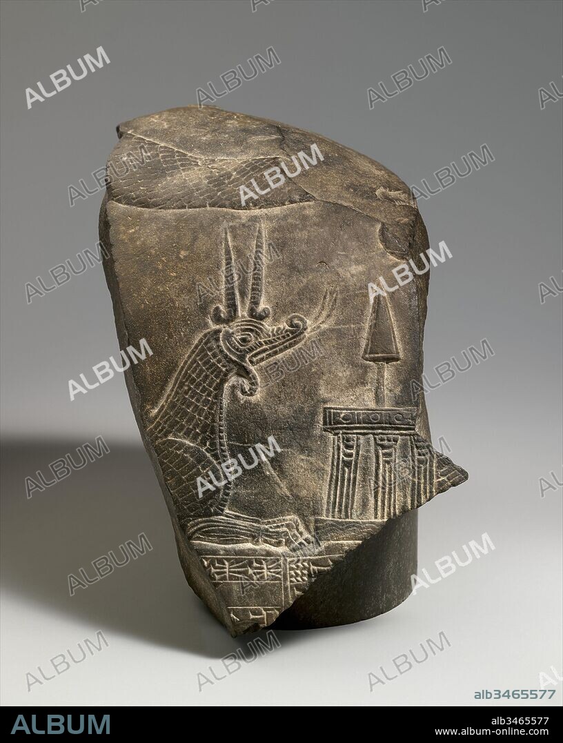 Top fragment of a kudurru with a mushhushshu dragon and divine symbols, Second Dynasty of Isin, ca. 1156–1025 B.C., Mesopotamia, Limestone, H. 6 1/2 x W. 4 x D. 7 1/4 in. (16.5 x 10 x 18.4 cm), Stone-Sculpture-Inscribed, Known as kudurrus or narus, a distinctive group of Babylonian stone monuments were once thought to be boundary markers placed in fields. In fact they are more likely to have been placed in temples, where their contents were preserved and sanctified.