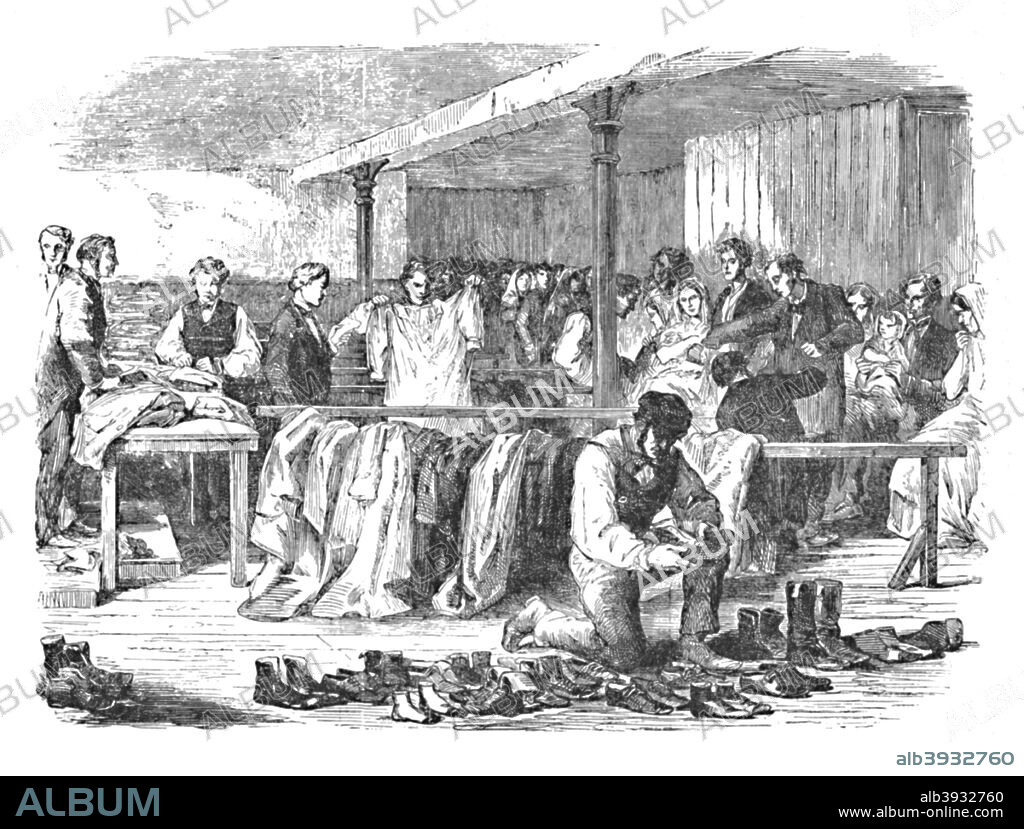 'The Cotton Famine: Distribution of Clothes to Operatives, Manchester', c1862, (1904). From Social England, Volume VI, edited by H.D. Traill, D.C.L. and J. S. Mann, M.A. [Cassell and Company, Limited, London, Paris, New York & Melbourne, 1904].