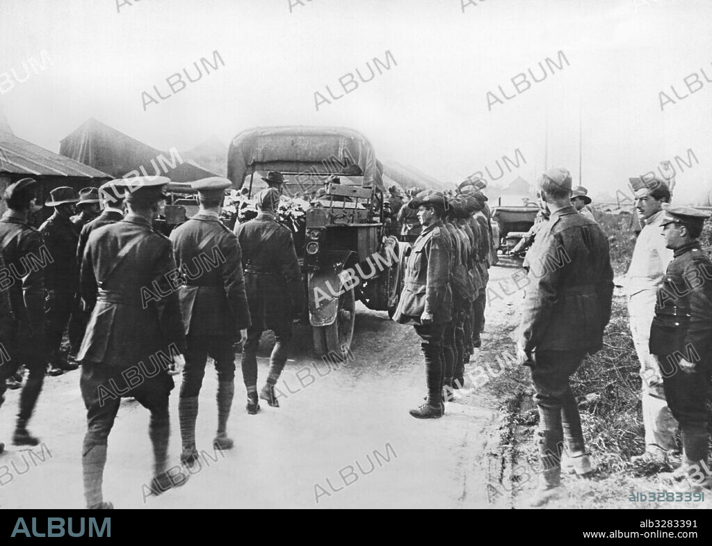 Amiens, France:  May 22, 1918 British flying officers are following on foot behind the funeral procession for Manfred von Richthofen, the German ace pilot know as the Red Baron. He was shot down on the Western Front, and his body fell behind the British lines. He was buried with full military honors.