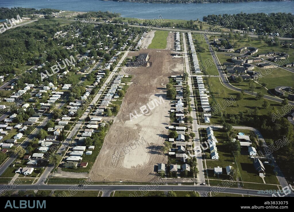 View of the Love Canal neighborhood, Niagara Falls, New York. The neighborhood was built on top of a toxic waste site, some of which was released in the 1970s due to heavy rainfall and construction, leading to a public health emergency and scandal. Today, houses in the residential areas on the east and west sides of the canal have been demolished.