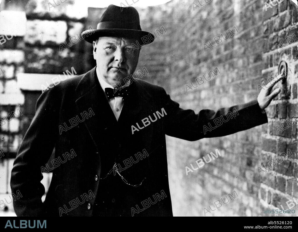 Mr. Winston Churchill, first lord of the Admiralty, rings the bell at the back door of No. 10. Downing Street, when he paid the Prime Minister a visit. December 21, 1939. (Photo by Universal Pictorial Press & Agency).