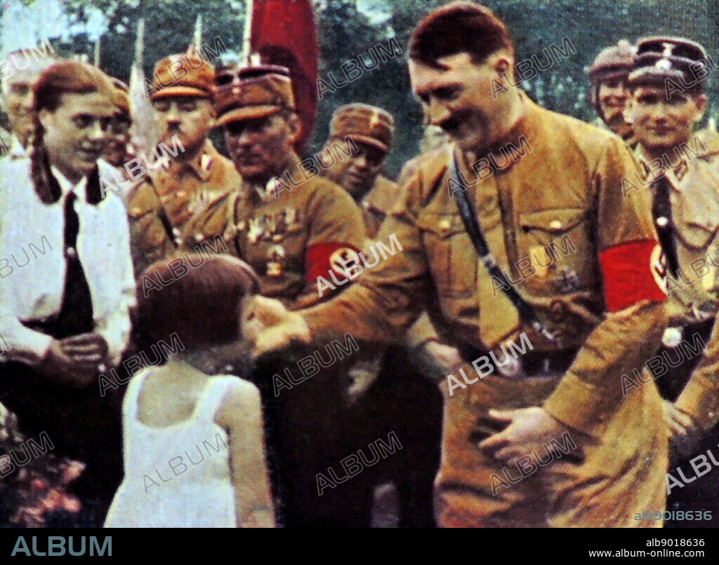 Hitler with adoring supporters. These photographs were taken to enhance the father of the nation status of Adolf Hitler after he became Chancellor of Germany in 1933.Rudolf Hess the Deputy Fuhrer is shown on theright.