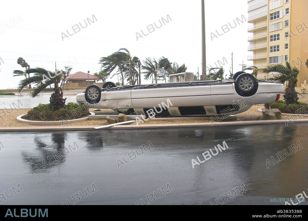 Overturned  car  after hurricane Wilma,  Fort Lauderdale, Florida, USA. Wilma developed the lowest atmospheric pressure ever measured in the North Atlantic basin,  just 882 millibars.  It struck Mexico and then Florida in mid-October 2005. Wilma was the 21st named storm in the 2005 hurricane season,  and the later development of tropical storm Alpha was the first time that the pre-assigned list of hurricane names had ever been exceeded. Photographed on 24th October 2005.