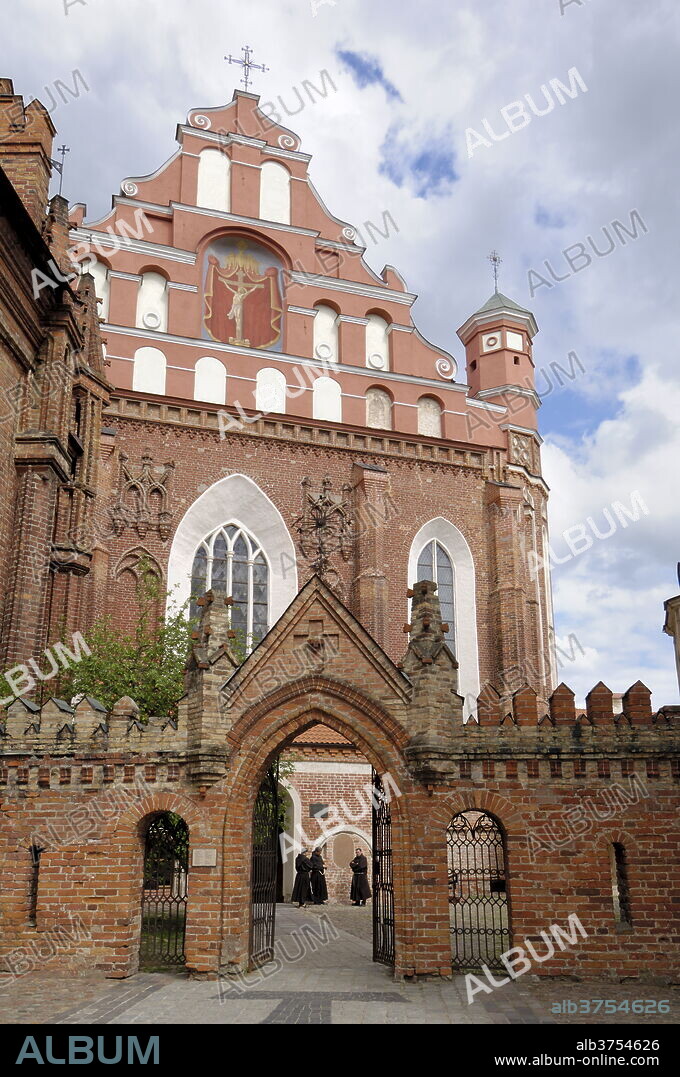 Bernardine church and monastery with monks standing by the door, Vilnius, UNESCO World Heritage Site, Lithuania, Baltic States, Europe.