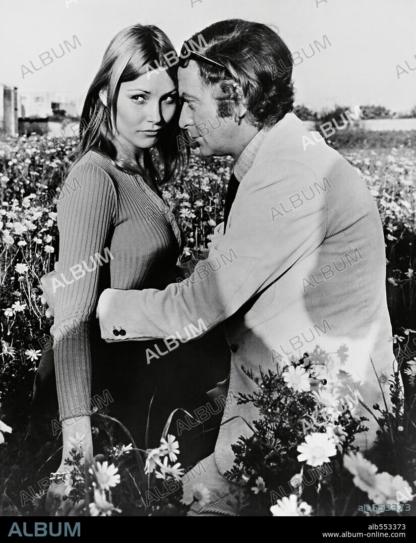 JANET AGREN and MICHAEL CAINE in PULP, 1972, directed by MIKE HODGES. Copyright UNITED ARTISTS.