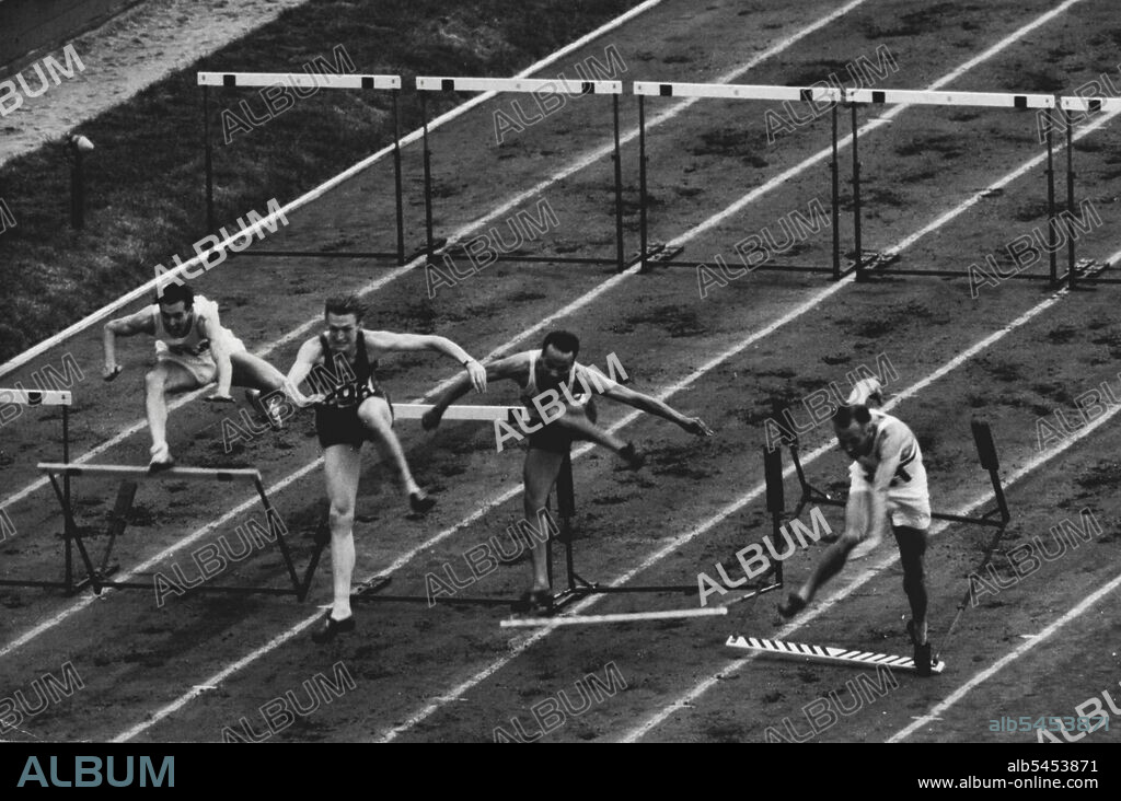 Olympic Games 1948 - 110 meters Hurdles. It was a tragic moment for Donald Finlay and for Gt. Britain, when he hit the last hurdle and stumbled when he was leading in his heat during the 110 metres Hurdles. It was his third and final Olympiad. Donald Finlay is seen hitting the final hurdle, before stumbling, allowing A. J. Marie of France to win. August 03, 1948.