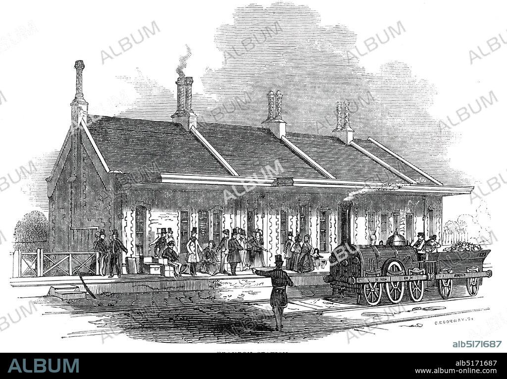 Brandon Station, 1845. Railway station at the town of Brandon in Suffolk, one of the stops on the newly opened line from London to Cambridge and Ely. 'The Brandon Station is built of flint, edged with greystone and brick of the same colour, the style of architecture is Elizabethan, and the appearance is peculiarly neat. The country here is not without beauty, though it wants the boldness of a grand landscape'. From "Illustrated London News", 1845, Vol VII.