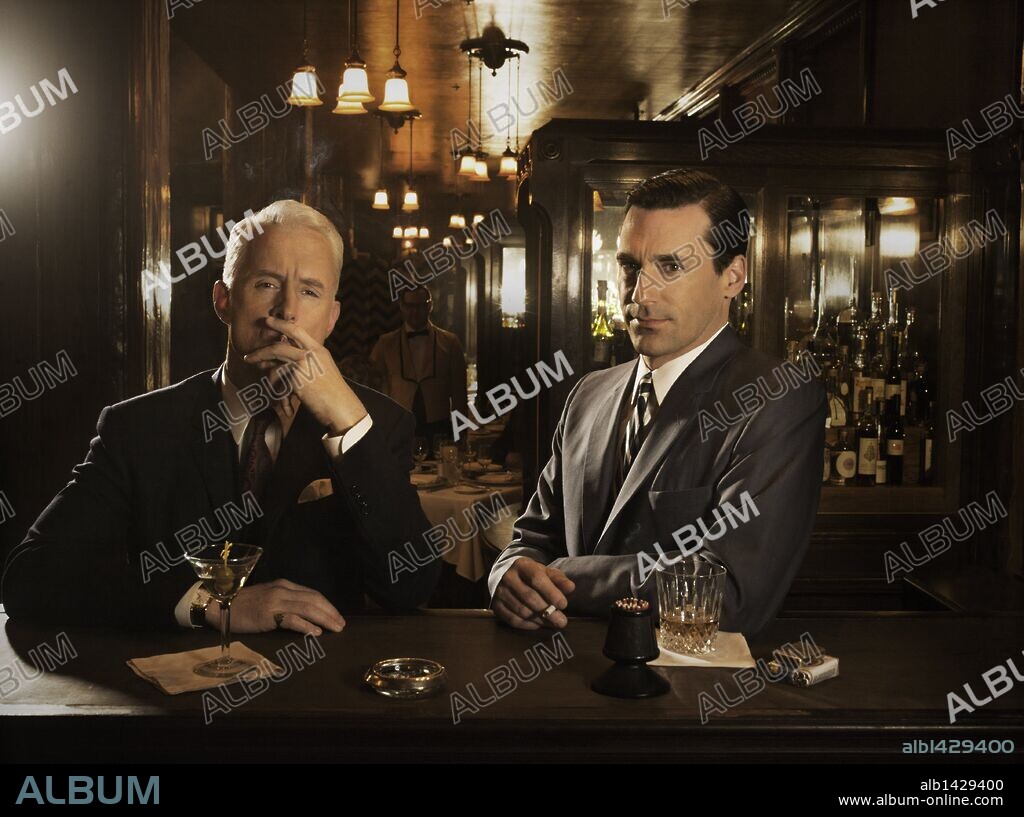 JOHN SLATTERY and JON HAMM in MAD MEN, 2007, directed by TIM HUNTER. Copyright AMERICAN MOVIE CLASSICS (AMC)/RADICAL MEDIA.