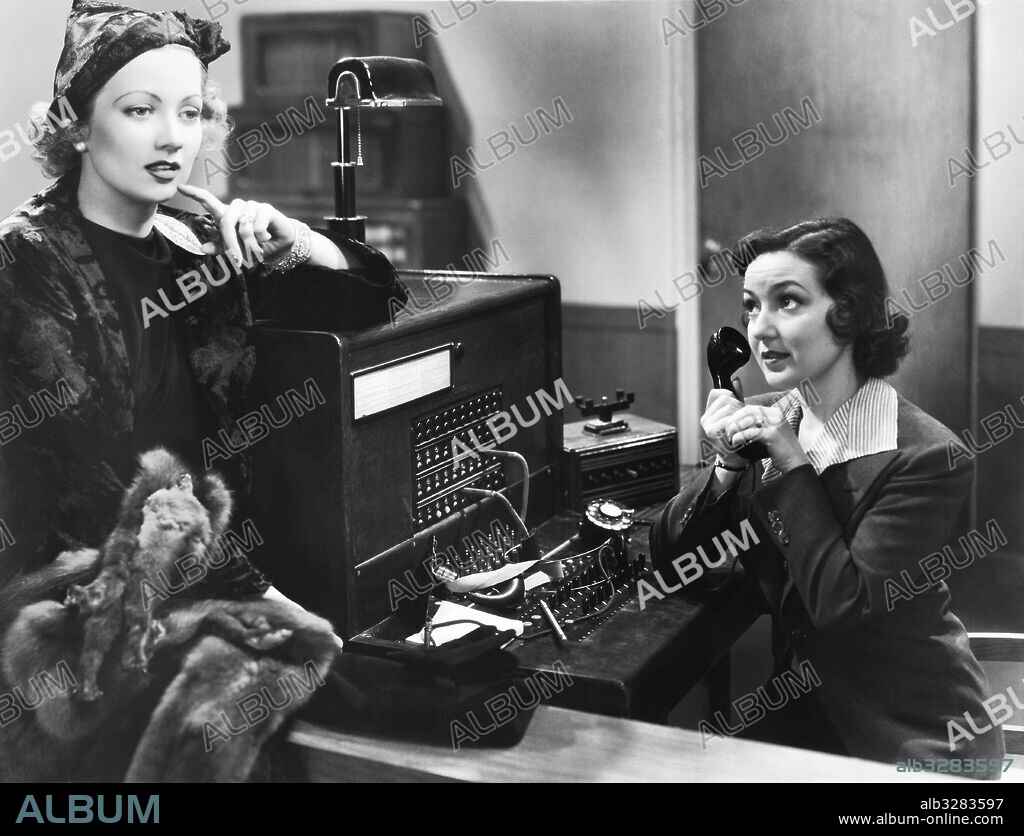 Hollywood, California:  c.1936 Actress Ann Sothern in a movie scene with a switchboard operator.