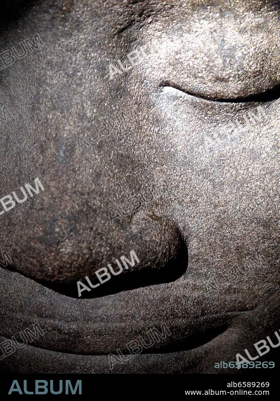Jayavarman VII King from 1181 to about 1218,in the Khmer Empire, a beliver of the Mahayana Buddhism, the statue shows the king in a state of thought , the hair style with the extra lobe at the top of.