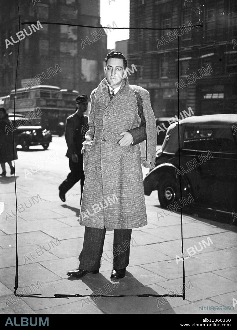 The International Wool Secretariat opened to their "Wool and the Man" Exhibition, which shows that the well-dressed male can buy for his money in wool, at Dorland House, Regent Street, London. Picture shows: the 'Inverness Cape' in Harris Tweed, features a zip fastened from neck-point to sleeve edge to give freedom of the arms for sporting wear besides serving a dual purpose of acting as both overcoat and cap. 5 September 1947.