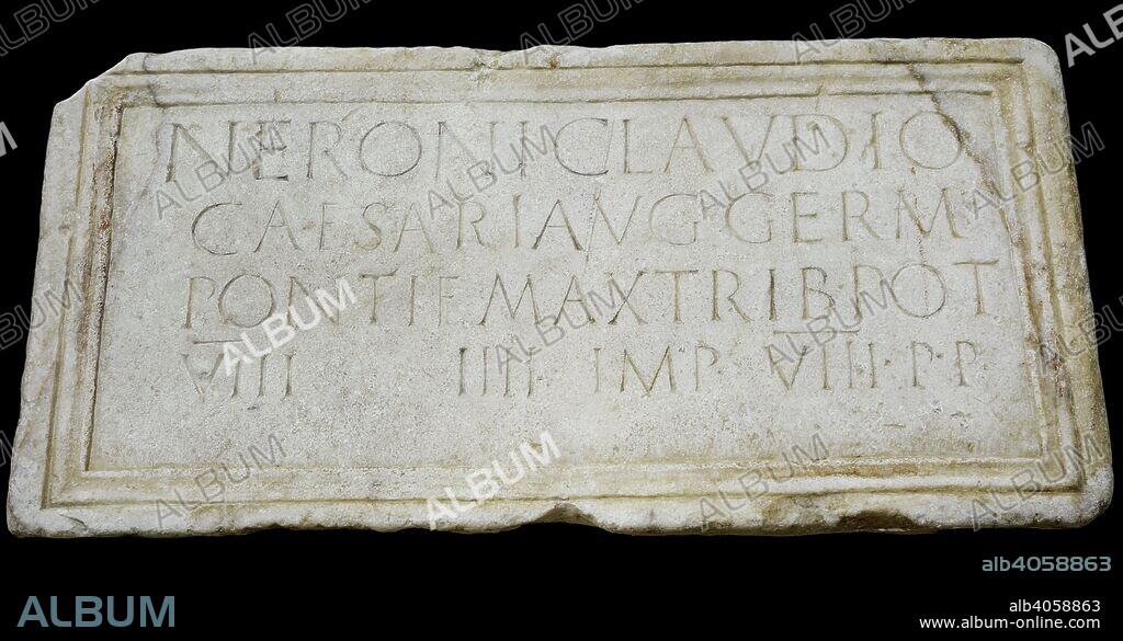 Stone plaque dedicated to emperor Nero (Nero Claudius Caesar Augustus Germanicus)  (37-68 AD) honouring his person and lists his titles: Pontifex Maximus, Tribune, Consul, Emperor and Father of the Homeland. 61-62 AD. Marble. From the Forum of Augusta Emerita (Merida, Badajoz province, Extremadura, Spain). National Archaeological Museum. Madrid. Spain.