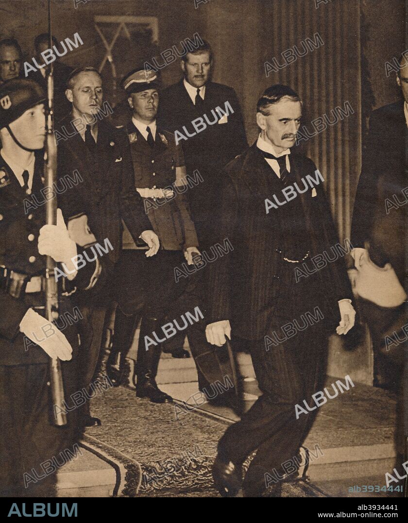 The meeting of  Neville Chamberlain (1869-1940) with Hitler in Berchtesgaden (Bavaria) on September 15 1938. The Berchtesgaden meeting was one of the stages of direct preparation for the Munich Pact of 1938. From These Tremendous Years 1919-1938. [Daily Express, London, 1938].
