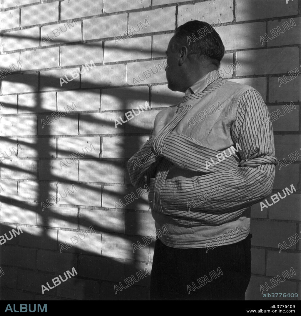 Male patient in a straight jacket in the Ohio Insane Asylum, 1946.