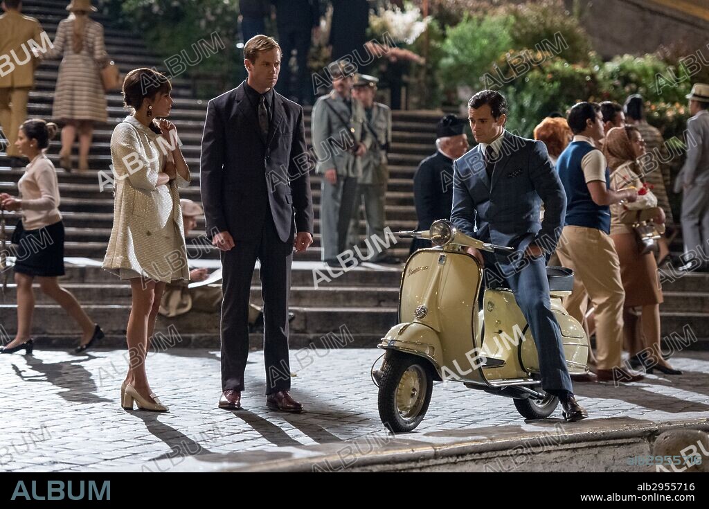 ALICIA VIKANDER, ARMIE HAMMER and HENRY CAVILL in THE MAN FROM U. N. C. L. E., 2015, directed by GUY RITCHIE. Copyright WARNER BROS.