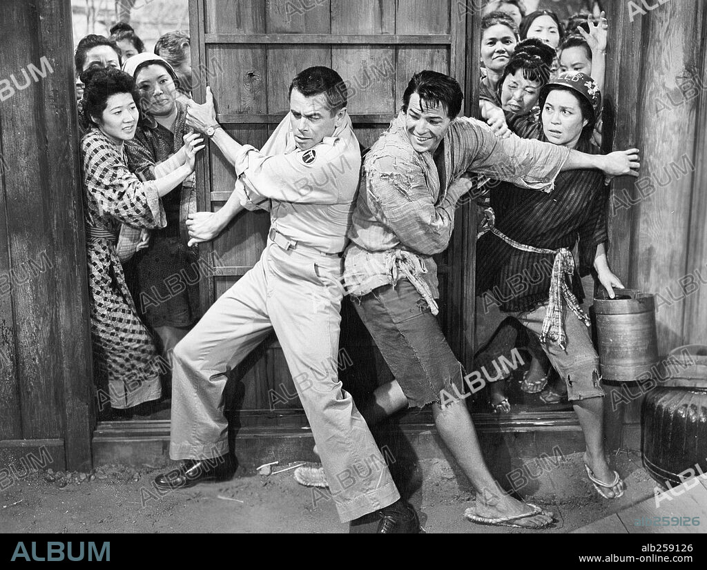 GLENN FORD and MARLON BRANDO in THE TEAHOUSE OF THE AUGUST MOON, 1956, directed by DANIEL MANN. Copyright M.G.M.