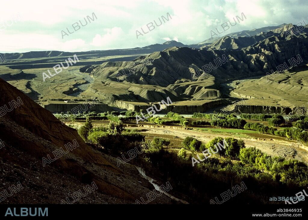 Paired river terraces along a tributary of the Yellow River at the edge of the Tibetan Plateau near Xining, Qinghai Province, China. The incision of the river is partly a response to the rapid uplift of the Tibetan Plateau.