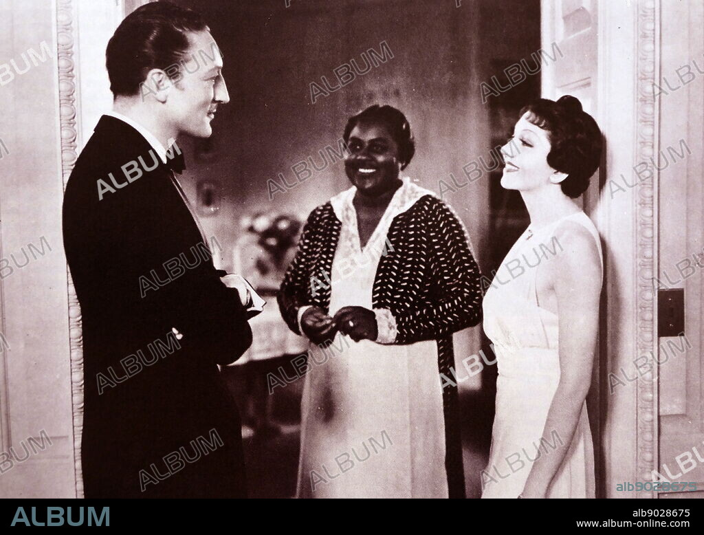 Imitation of Life is a 1934 American drama film directed by John M. Stahl. The screenplay by William Hurlbut, based on Fannie Hurst's 1933 novelo. The film stars Claudette Colbert, Warren William. In this scened Hattie McDaniel appears with Warren William and Claudette Colbert. Mc Daniel was a pioneer African American actress.