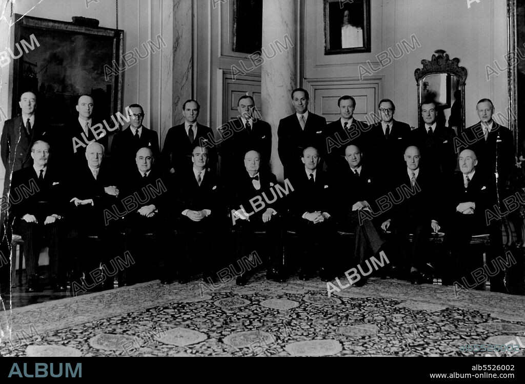 Sir Winston with his Cabinet -- (Left to right - Back row) Mr.Osbert Peake, Mr.Peter Thorneycroft, Sir Walter Monkton, Mr.Stuart, Mr.Lloyd George, Mr.Lennox-Boyd, Mr.Duncan Sandys, Sir Norman Brook (Secretary to the Cabinet), (front row) Mr. MacMillan, Lord Woolton, Lord Kilmuir, Sir Anthony Eden, Sir Winston Churchill, Lord Salisbury, Mr. Butler, Lord Swinton and Mr. Crookshank.Sir Winston Churchill Photographed at No.10. Downing street after this morning's Cabinet Meeting. April 05, 1955. (Photo by Paul Popper, Paul Popper Ltd.).