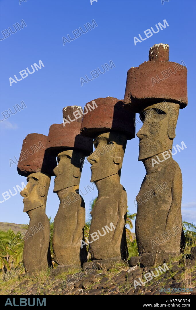 Anakena beach, monolithic giant stone Moai statues of Ahu Nau Nau, four of which have topknots, Rapa Nui (Easter Island), UNESCO World Heritage Site, Chile, South America.