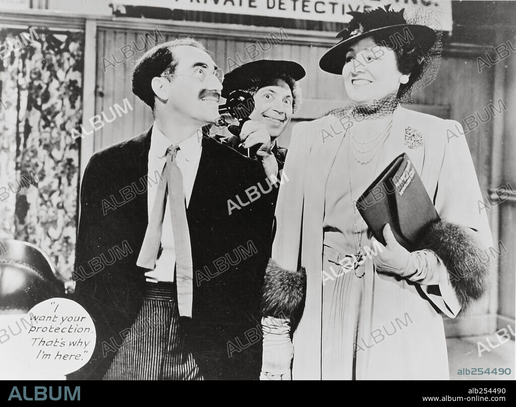 CHICO MARX, GROUCHO MARX and MARGARET DUMONT in THE BIG STORE, 1941, directed by CHARLES REISNER. Copyright M.G.M.