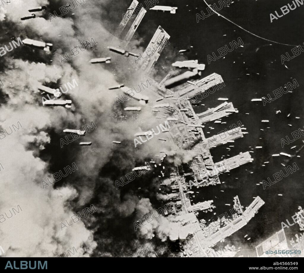 Kobe, Japan,  June, 1945 B-29 bombers dropping thousands of incendiary bombs upon the industrial city.