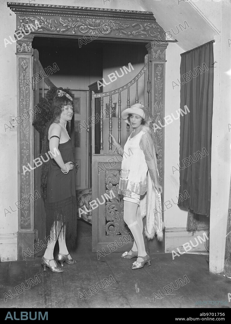 Canadian artist presented to the Queen . Mrs Macavity , the Canadian portrait painter , who was amongst those presented to the Queen on the occasion of Her Majesty ' s visit to the Dominion Artists ' exhibition , photographed with her daughter in the costumes they wore at the ball at Spring Gardens galleries . 19 March 1926.