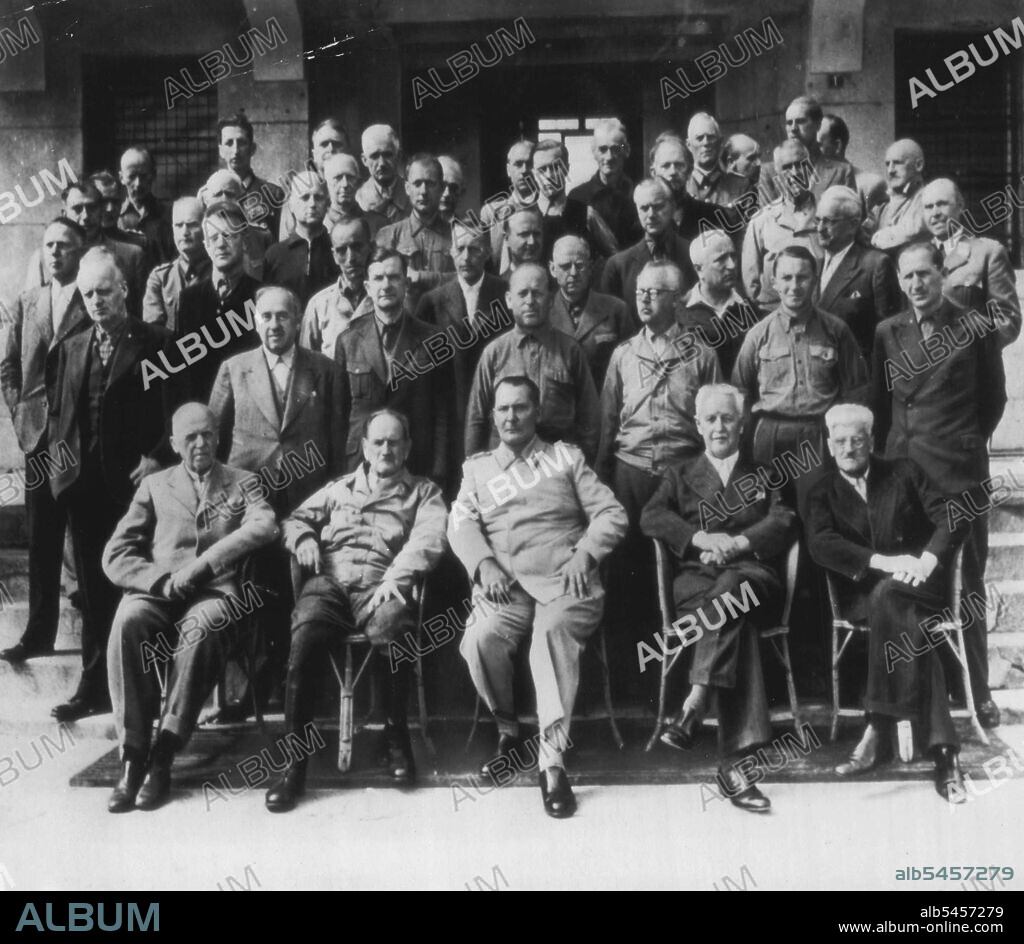 This group picture of most of Nazi Germany's leaders, which just became available, was made last summer at Mondorf-les-bains, in Luxemburg, then the Anglo-American jail for top-ranking German prisoners. Left to Right, Front Row: Hans Lammers; Franz Von Epp; Hermann Goering; Franz Xaver Schwarz; Otto Meissner. Second row-left to right; Joachim Von Risbentrop; Walter Funk; Ernst Bohle; Jakob Nagel; Franz Schwarz; Herbert Buechs Otto Salman. Third Row, Left to Right: Haws  Frank; Hans Riecke; Karl Doenitz, Johannes Blaskowitz; Hermann Reinecke; Ernst John Von Freyend; Hans Riecke; Karl Stroelin; Alfred Jodl; Gerhard Wagner; Karl Brendt; Philipp Von Hessen; Paul Wegner (Directly behind Nagel); Walter Warlimont (Rear row, behind Wegner). October 31, 1945. (Photo by AP Wirephoto).
