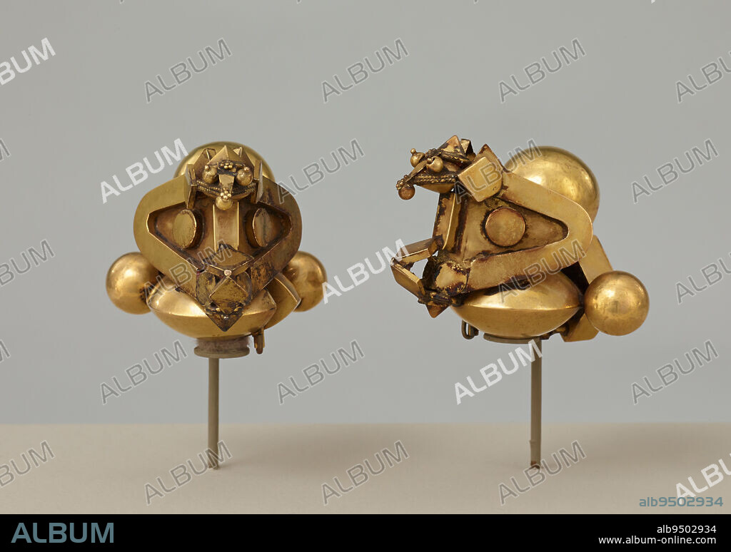 Pambadam Earrings, 19th-20th century, 2 1/4 x 2 x 2 1/8 in. (5.72 x 5.08 x 5.4 cm), Gold, India, 19th-20th century, The unique shape of these earrings represents an abstracted image of a cobra laying eggs on her nest. Amid the complex arrangement of geometric forms, one can discern two bulging eyes on a widespread hood. Especially in rural regions of Southern India, where these earrings were commonly worn, snakes are simultaneously revered and feared. While they signal protection, their close association with water and the earth also makes them emblems of fortune and fertility.