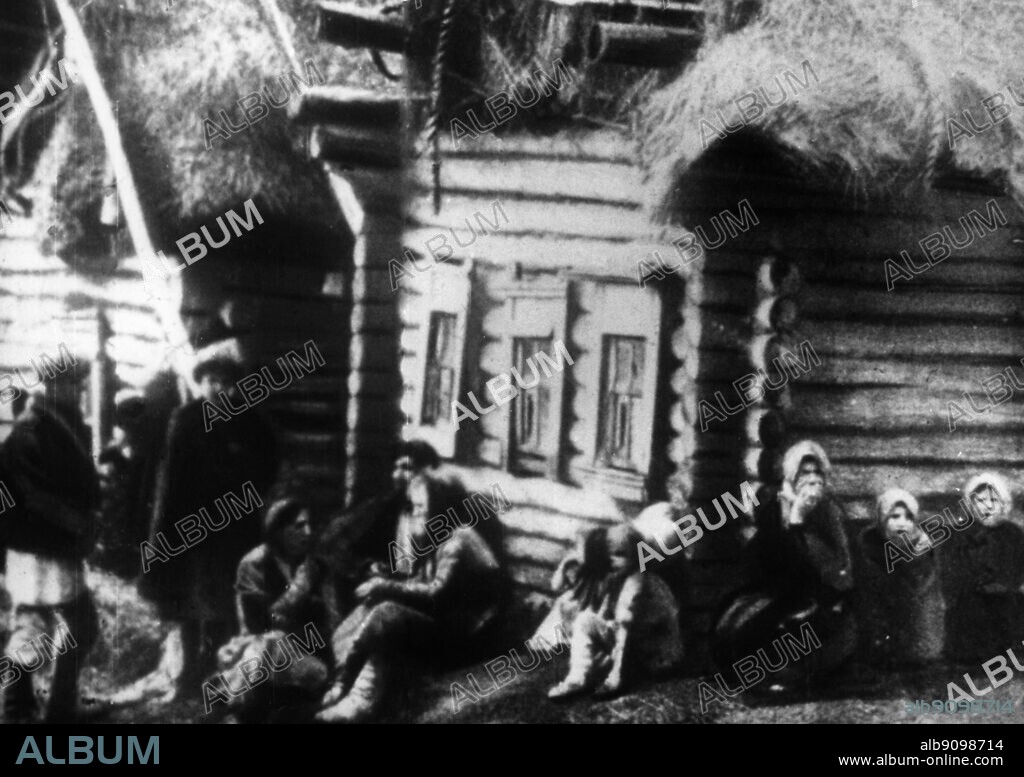 Russian peasants during famine c.1900s - The Russian famine of 1921-23, Povolzhye famine, was a true famine: hunger so severe that it was doubtful that seed-grain would be sown rather than eaten. At one point, relief agencies had to give grain to the railroad staff to get their supplies moved. Famine, which killed an estimated 5 million, affected mostly the Volga-Ural region and Ukraine. The famine resulted from the combined effect of the disruption of the agricultural production, already started during World War I and continued through the disturbances of the Russian Revolution of 1917 and Russian Civil War with its policy of War Communism, especially prodrazvyorstka. One of Russia's intermittent droughts that happened in 1921 aggravated the situation to the level of the national catastrophe. In many cases recklessness of local administration, which recognized the problems only too late, contributed to the tragedy. ©TopFoto.