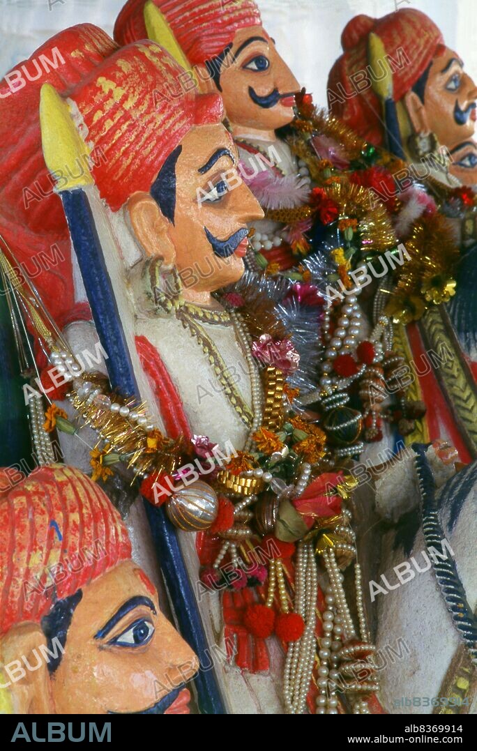 Jakh Botera, Jakhdada, Jakkha Bautera, 72 Yaksha or Bohter Yaksha, literally seventy-two Yaksha warriors, are a group of folk deities worshipped widely in the Kutch district of Gujarat.<br/><br/>. The Jakhs are said to have been shipwrecked on the Kutch coast and came ashore at a place now known as Jakhau. Described as tall and with fair complexions and an advanced culture, their traditional number is seventy-two with at least one woman.<br/><br/>. Kutch (often spelled Kachch) is the northwestern part of the Indian state of Gujarat, divided from the main part of the state by the Arabian Sea and a stretch of salt marshes. To its north lies the Pakistani province of Sind. The name Kutch is said to be derived from the Kachelas, a sub-caste of the <i>lohar</i> (blacksmiths) or <i>soni</i> (goldsmiths) castes.
