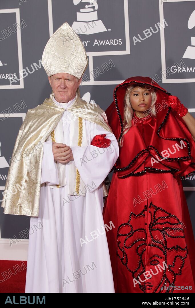 Feb. 12, 2012 - Los Angeles, California, U.S. - Hip-hop artist NICKI MINAJ, wearing a red Atelier Versace hooded dress, arrives with a Pope as her date for the 2012 Grammy Awards at the Staples Center. 12/02/2012