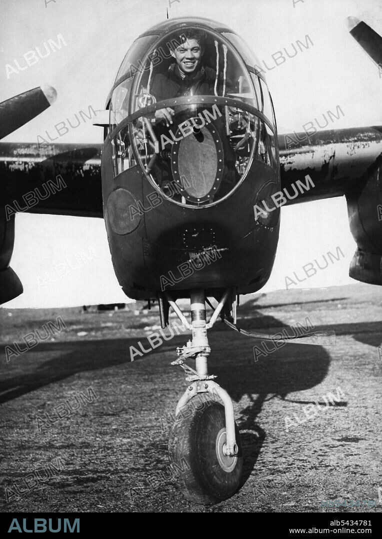 American War Planes In England -- The bomb-aimer's cockpit of the Douglas Boston III twin-engined bomber showing the front wheel of the tricycle undercarriage. War planes from the United States are arriving in England in a Steady flow. Heavy bombers are being "ferried" by air across the an Atlantic by both American and British Planes. Photographs taken at an aerodrome in England where many of the aircraft are overhauled before passing into service with the Royal Air Force. April 12, 1944.