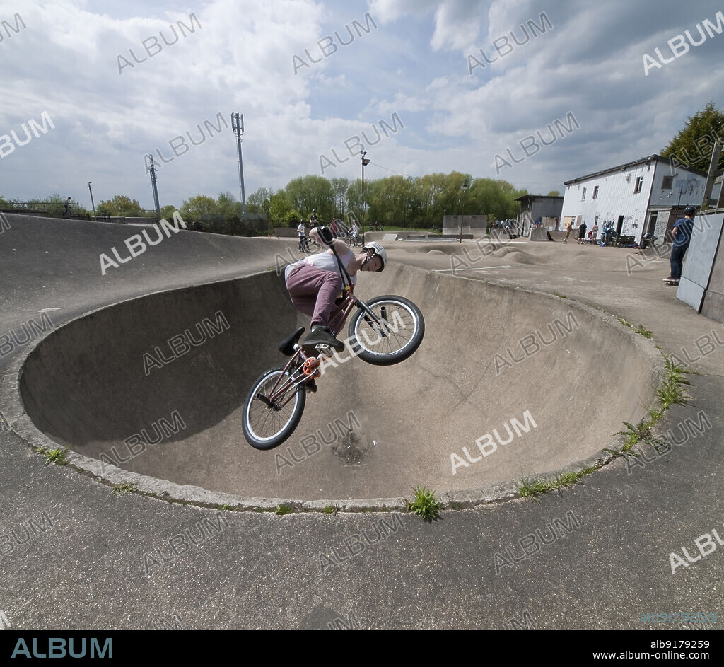 SIMON INGLIS. The Rom skatepark, Hornchurch, Havering, Greater London Authority, 2013. A BMX rider in the 'Performance Bowl' at The Rom skatepark, Hornchurch. The Rom skatepark was designed by Adrian Rolt of G-Force, and was built in 1978. It is London's oldest commercial skatepark and is listed at Grade II.
