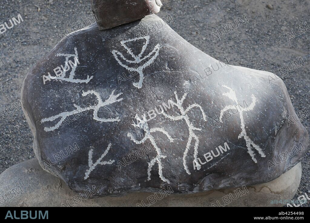 Hunting scene from the San Francisco de Miculla petroglyphs, commonly known as the Miculla petroglyphs, located 22 kilometres from Tacna, Peru. They are carved in low relief in the rocks, and depict people fighting, dancing and hunting animals. They are believed by many to be around 1500 years old, although various people date them from as wide a time period as 500 AD to 1445 AD.