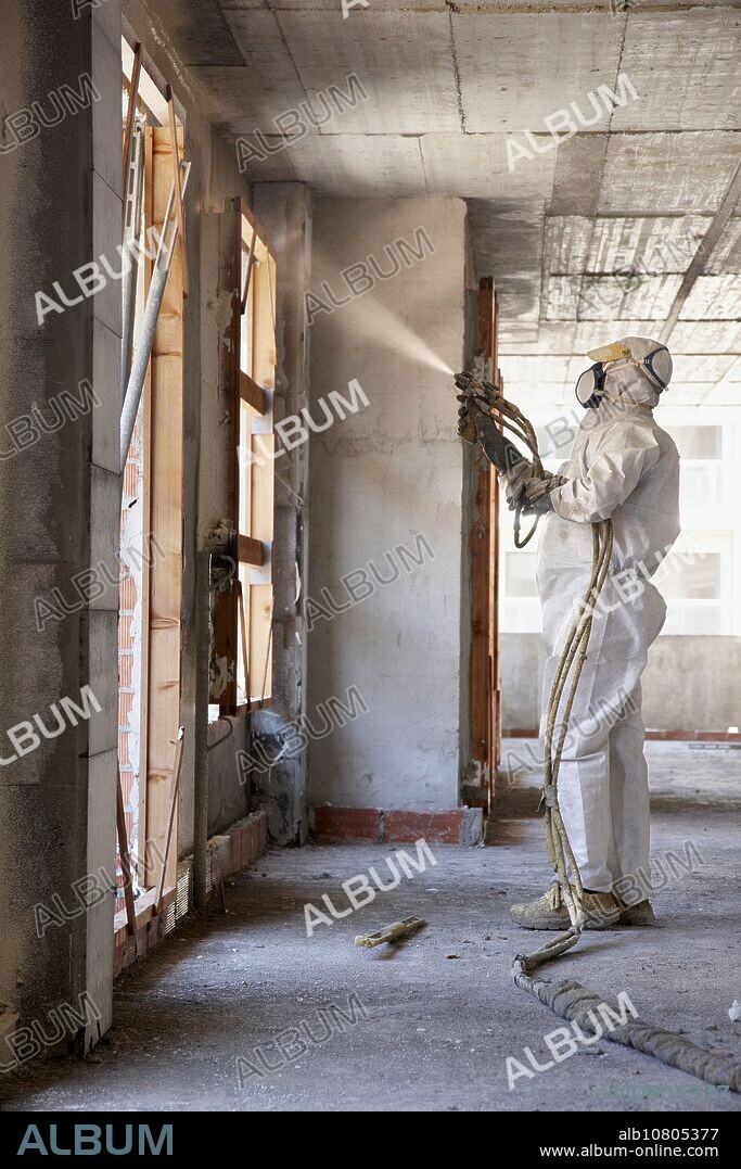 Spraying polyurethane foam, thermal and acoustic insulation, housing under construction. Donostia, Gipuzkoa, Basque Country, Spain.