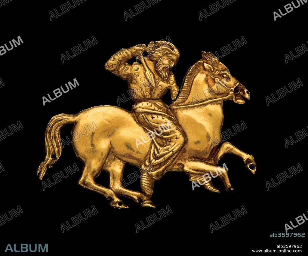 SCYTHIAN ART. Gold plaque depicting a Scythian rider with a spear in his right hand.