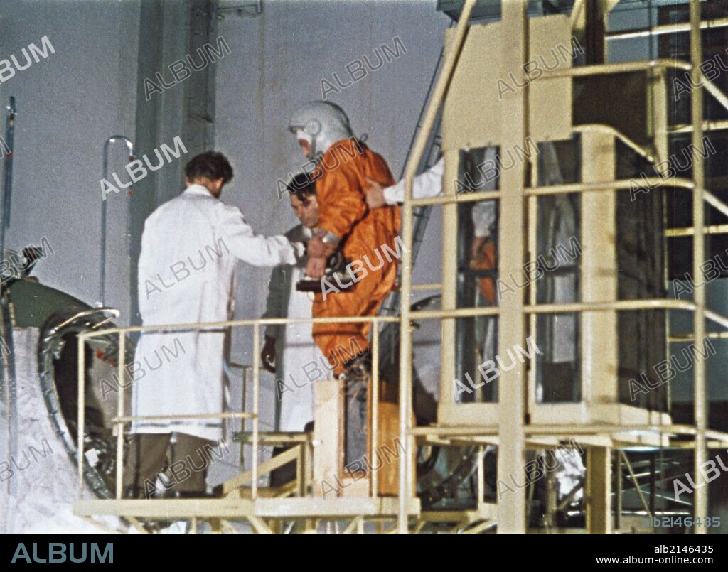 Soviet cosmonaut yuri gagarin boarding vostok 1 rocket in 1961, this is a still from a soviet film about the space program.