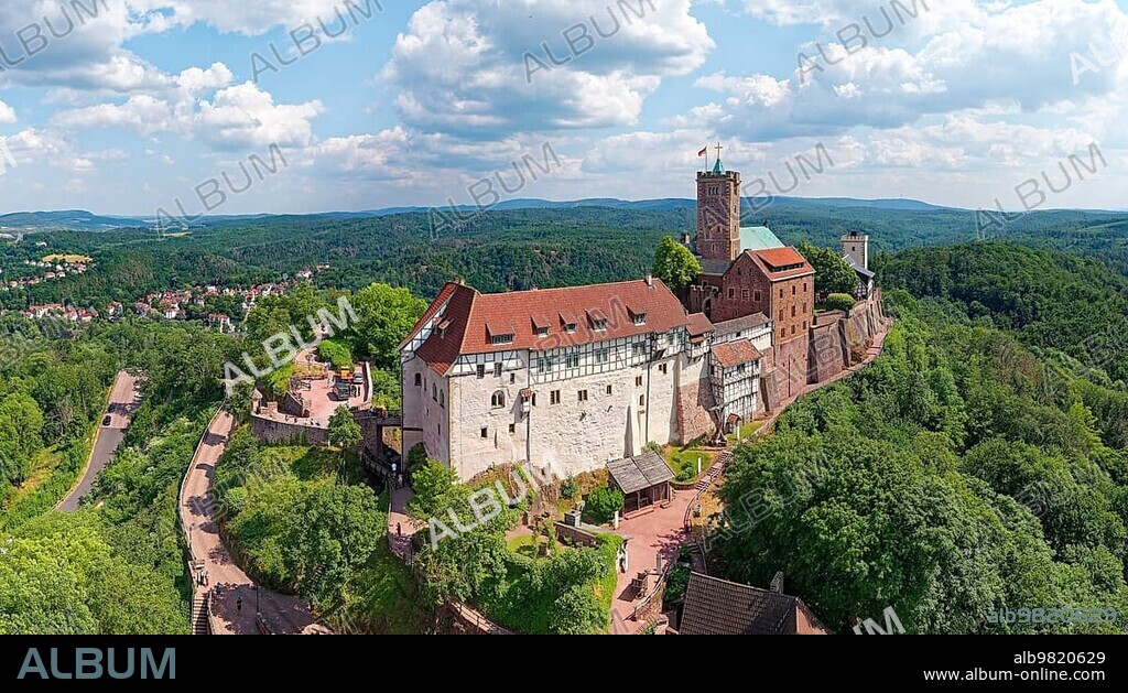 Wartburg; hilltop castle; sectional castle; 411 m a.s.l.; originally built in 1067 by Ludwig the Knight; rebuilt in the 19th century; buildings from left drawbridge; gatehouse; knights' house with Luther Room; Dirnitz; Thorhalle and garden; keep next to it on the left; bower and palace or landgrave's house behind; south tower behind on the right; aerial view; UNESCO World Heritage Site; Eisenach; Thuringian Forest; Thuringia; Germany; Europe.